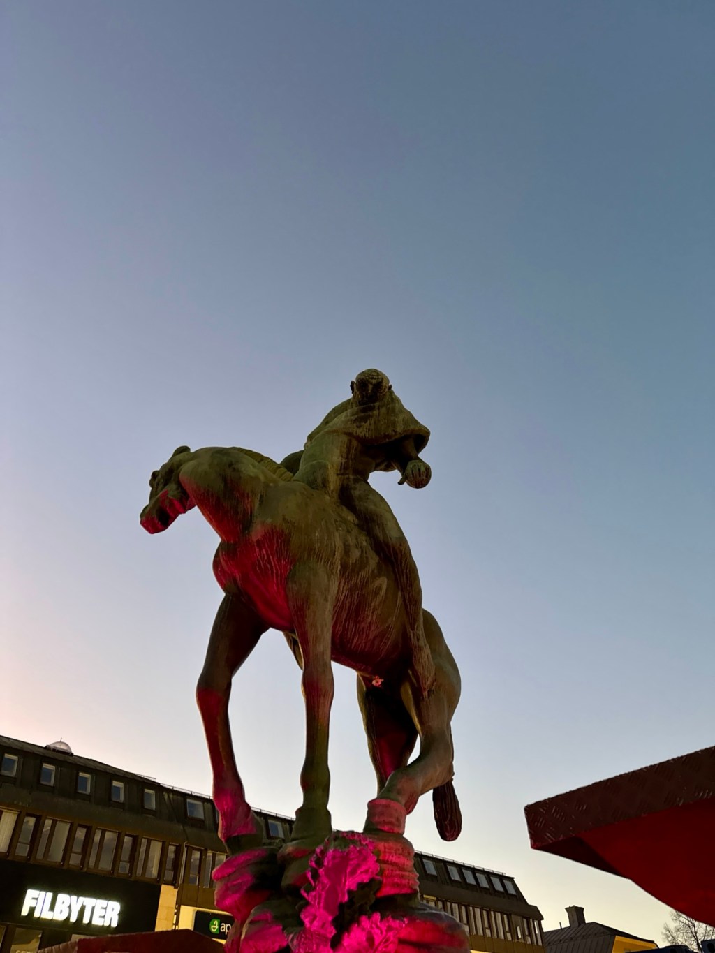 the statue of Folke Filbyter pictured at dusk in Stora Torget in Linköping Sweden